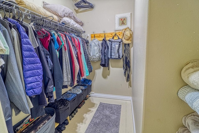 spacious closet with tile patterned flooring