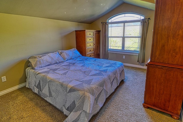 bedroom featuring vaulted ceiling and carpet flooring