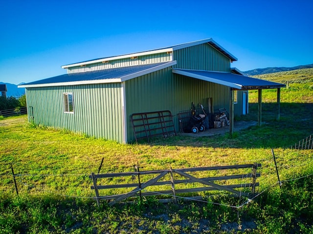 view of side of home with an outbuilding