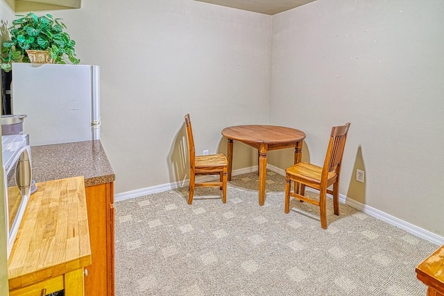 view of carpeted dining area