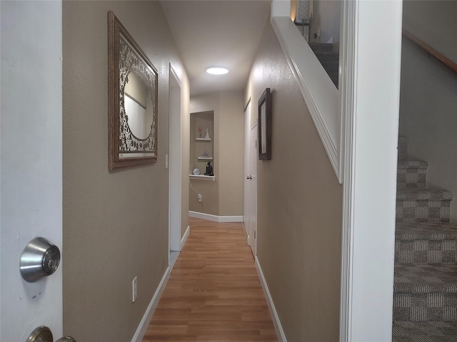 hallway with light wood-type flooring