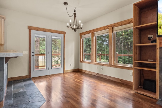 interior space featuring plenty of natural light and a chandelier