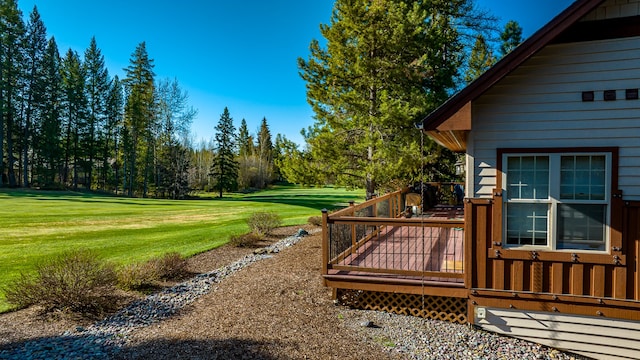 view of yard with a wooden deck