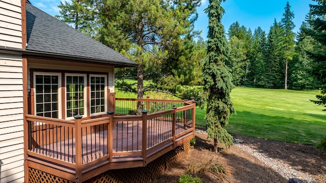 wooden deck with a lawn