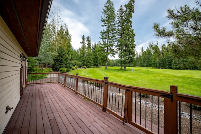 wooden terrace with a lawn