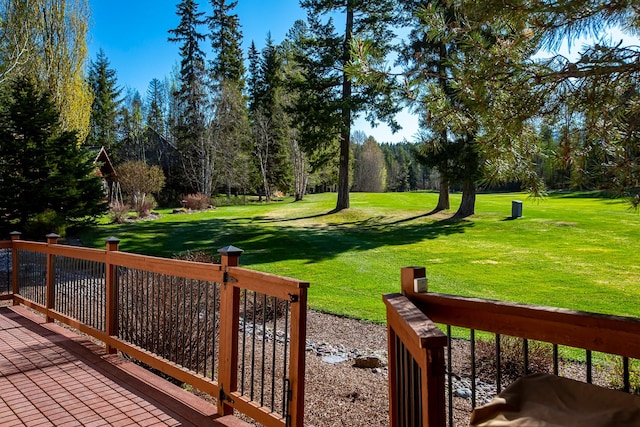 view of community featuring a yard and a deck