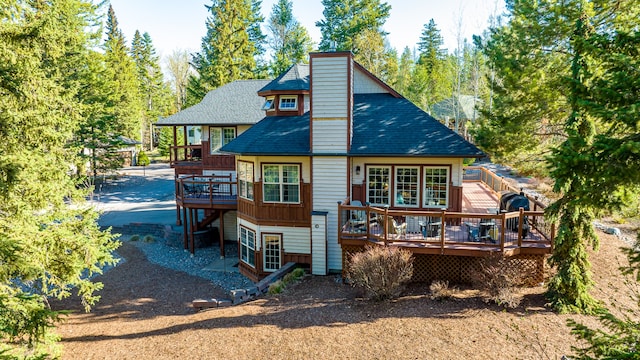 rear view of property with a deck