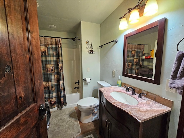 bathroom with shower / bathtub combination with curtain, toilet, and vanity