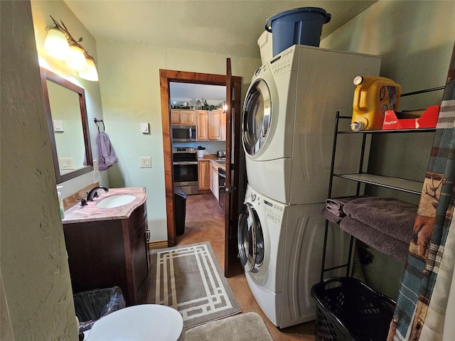 laundry room with stacked washer and clothes dryer, a sink, and laundry area