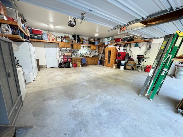 garage featuring a garage door opener and a workshop area