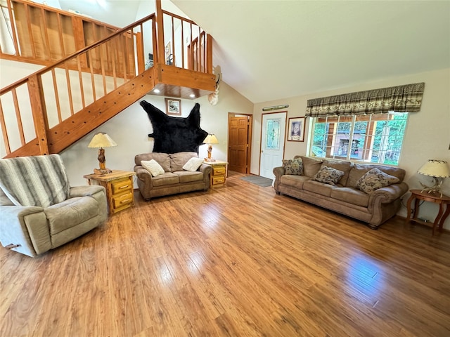 living room with lofted ceiling and hardwood / wood-style floors