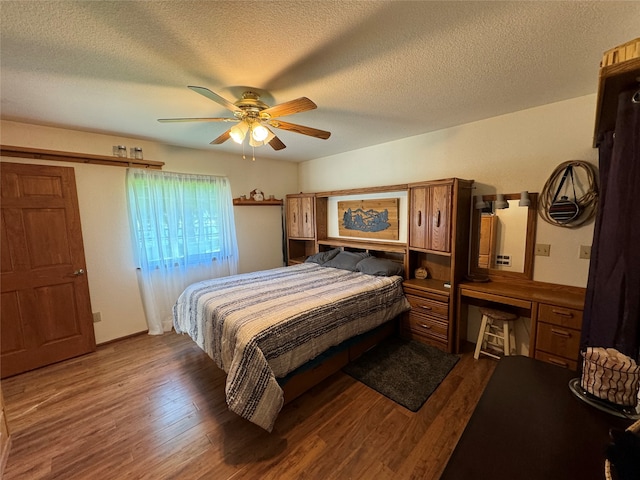 bedroom featuring a textured ceiling, dark hardwood / wood-style flooring, and ceiling fan