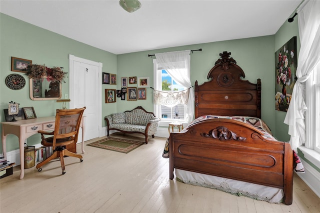 bedroom with light hardwood / wood-style flooring