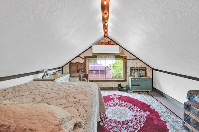 bedroom featuring lofted ceiling and a textured ceiling