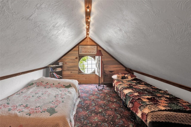 bedroom with wood walls and vaulted ceiling