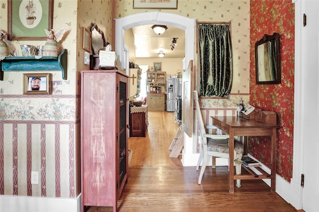 hall with hardwood / wood-style floors