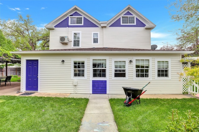 back of property featuring a yard and an AC wall unit