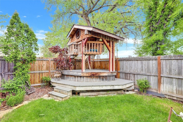 wooden terrace with a lawn