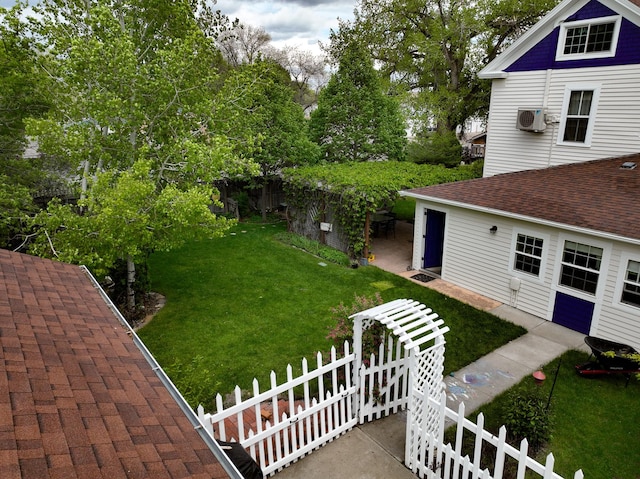 view of yard featuring an AC wall unit