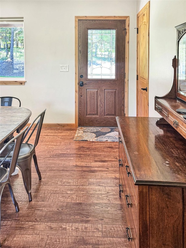 foyer featuring wood finished floors