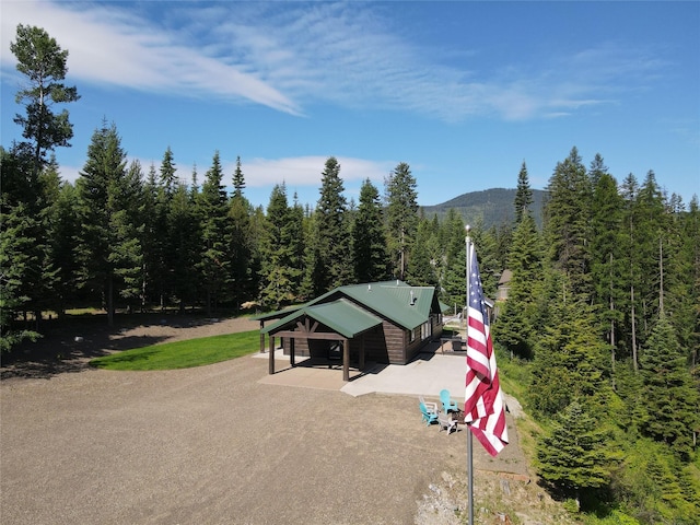 bird's eye view with a wooded view and a mountain view