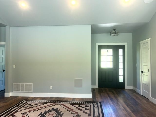 entrance foyer featuring dark hardwood / wood-style floors