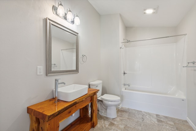 full bathroom featuring toilet, shower / washtub combination, and sink