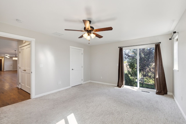 empty room with carpet floors and ceiling fan