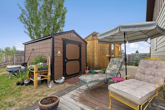 wooden deck with a shed