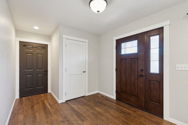 entrance foyer featuring dark wood-type flooring