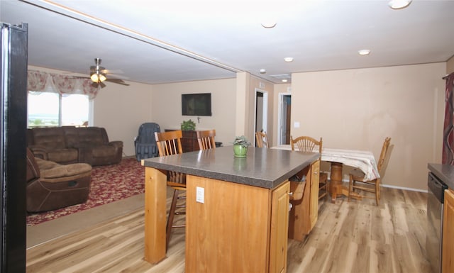 full bathroom featuring hardwood / wood-style floors, vanity, toilet, and bath / shower combo with glass door