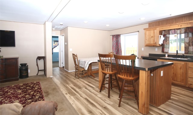 washroom with light wood-type flooring and independent washer and dryer