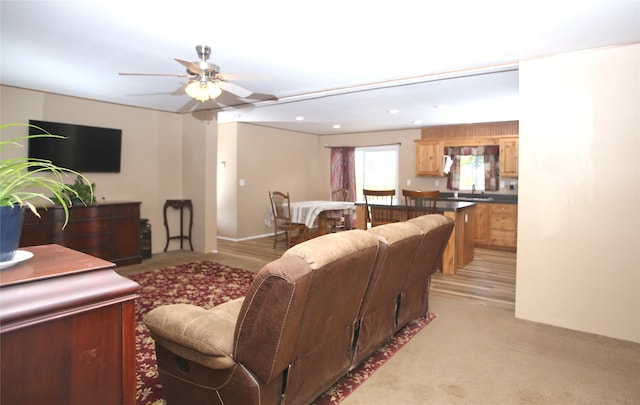 clothes washing area with cabinets, washer / dryer, sink, and dark hardwood / wood-style flooring