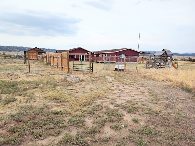 view of yard featuring a playground and a rural view