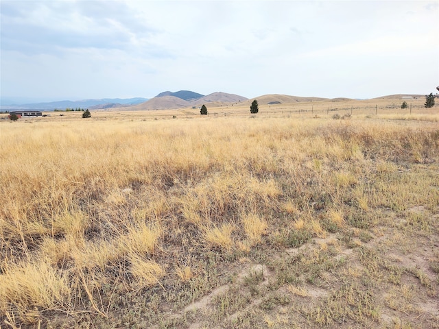 property view of mountains featuring a rural view