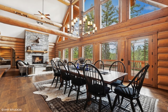 dining area featuring high vaulted ceiling and plenty of natural light