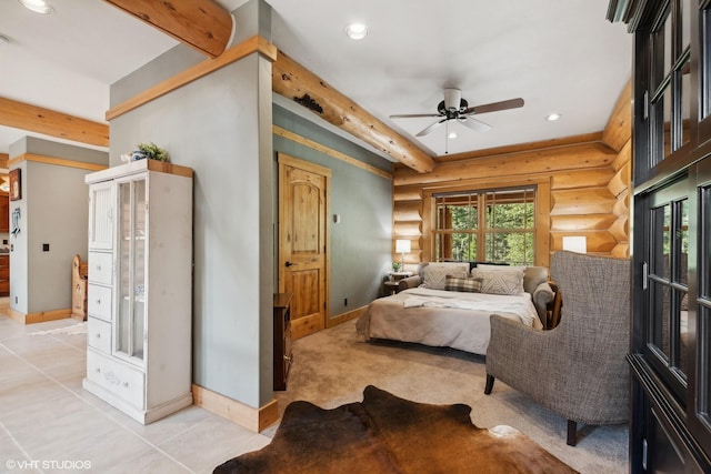 bedroom with ceiling fan, log walls, and light tile patterned flooring