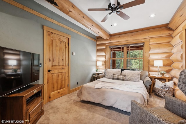 bedroom featuring carpet floors, ceiling fan, beamed ceiling, and log walls