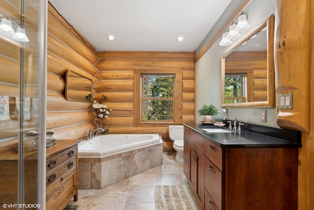 bathroom with log walls, vanity, a relaxing tiled tub, and toilet