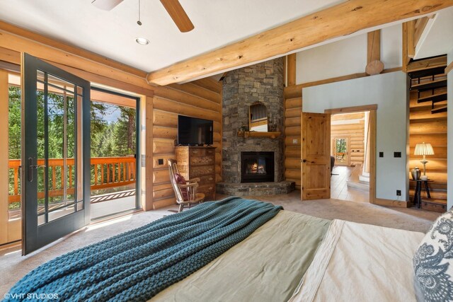 bedroom with a fireplace, access to outside, rustic walls, and multiple windows