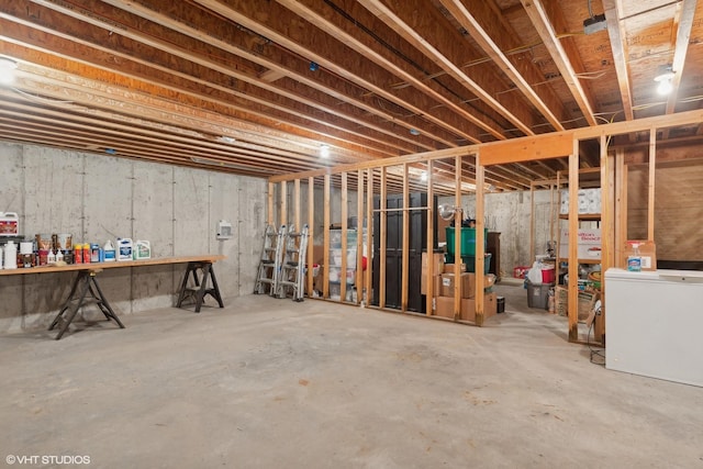 basement featuring refrigerator