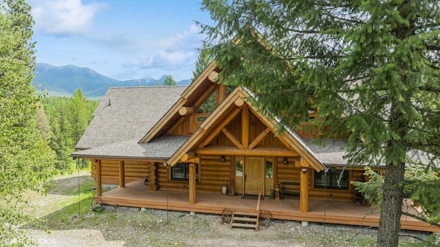 log cabin with a mountain view