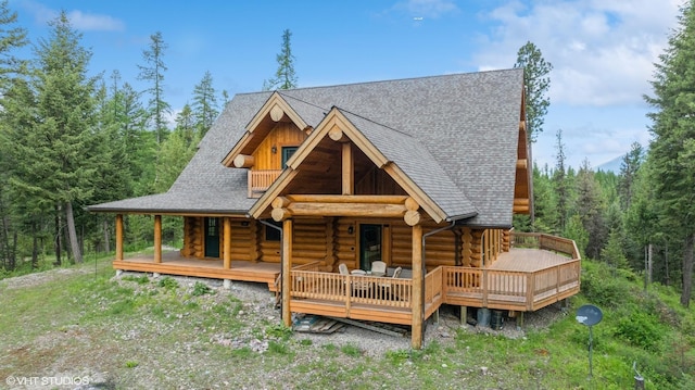 rear view of house featuring a porch