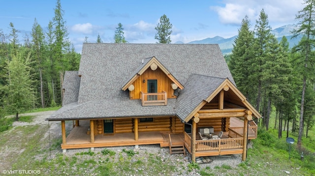 view of front of property featuring a mountain view and covered porch