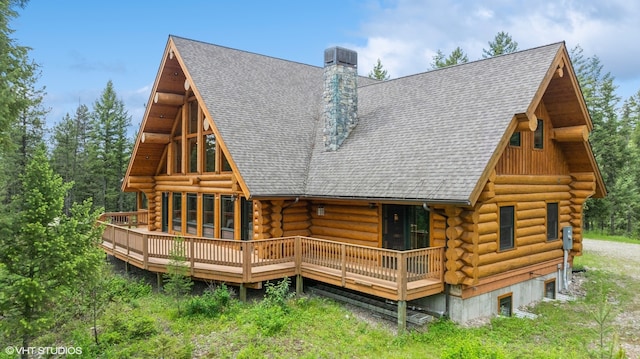 rear view of property with a deck