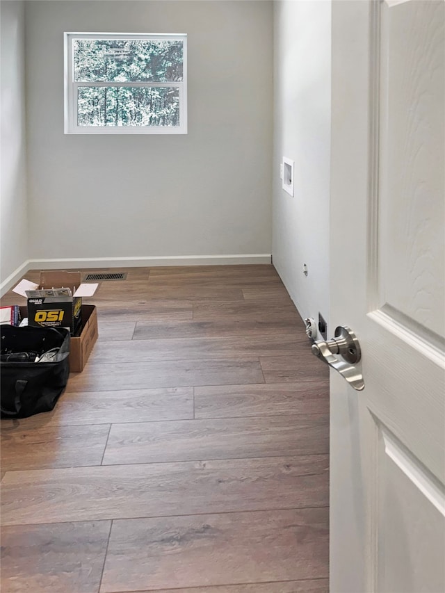 unfurnished room featuring wood-type flooring