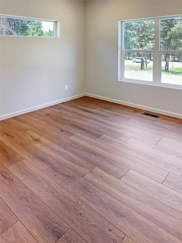 spare room featuring hardwood / wood-style floors