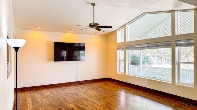 spare room featuring hardwood / wood-style flooring, ceiling fan, and lofted ceiling