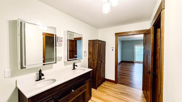 bathroom featuring hardwood / wood-style flooring and vanity