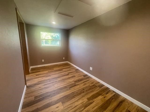 unfurnished room featuring hardwood / wood-style floors